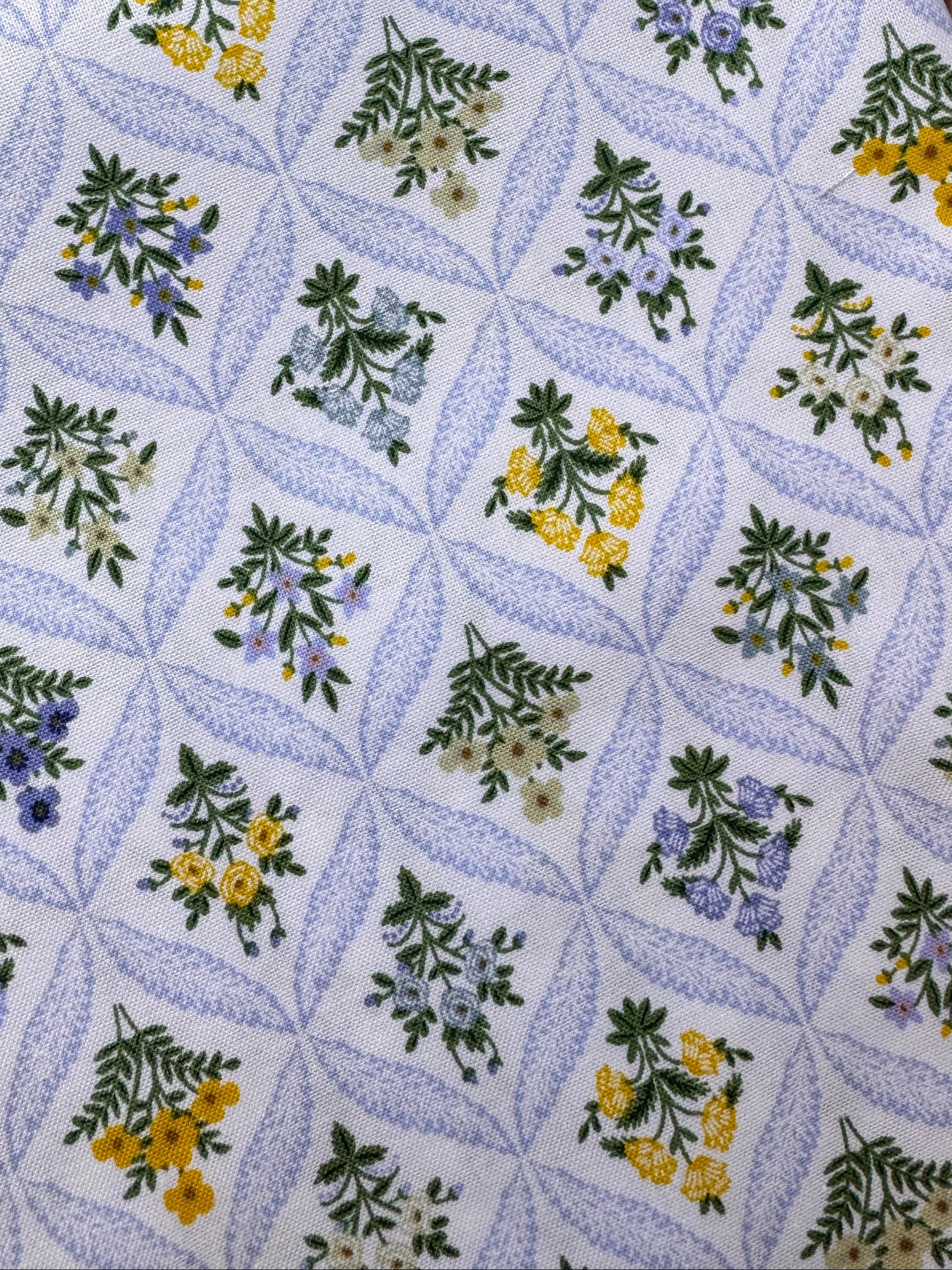 Floral patterned fabric on a wooden surface
