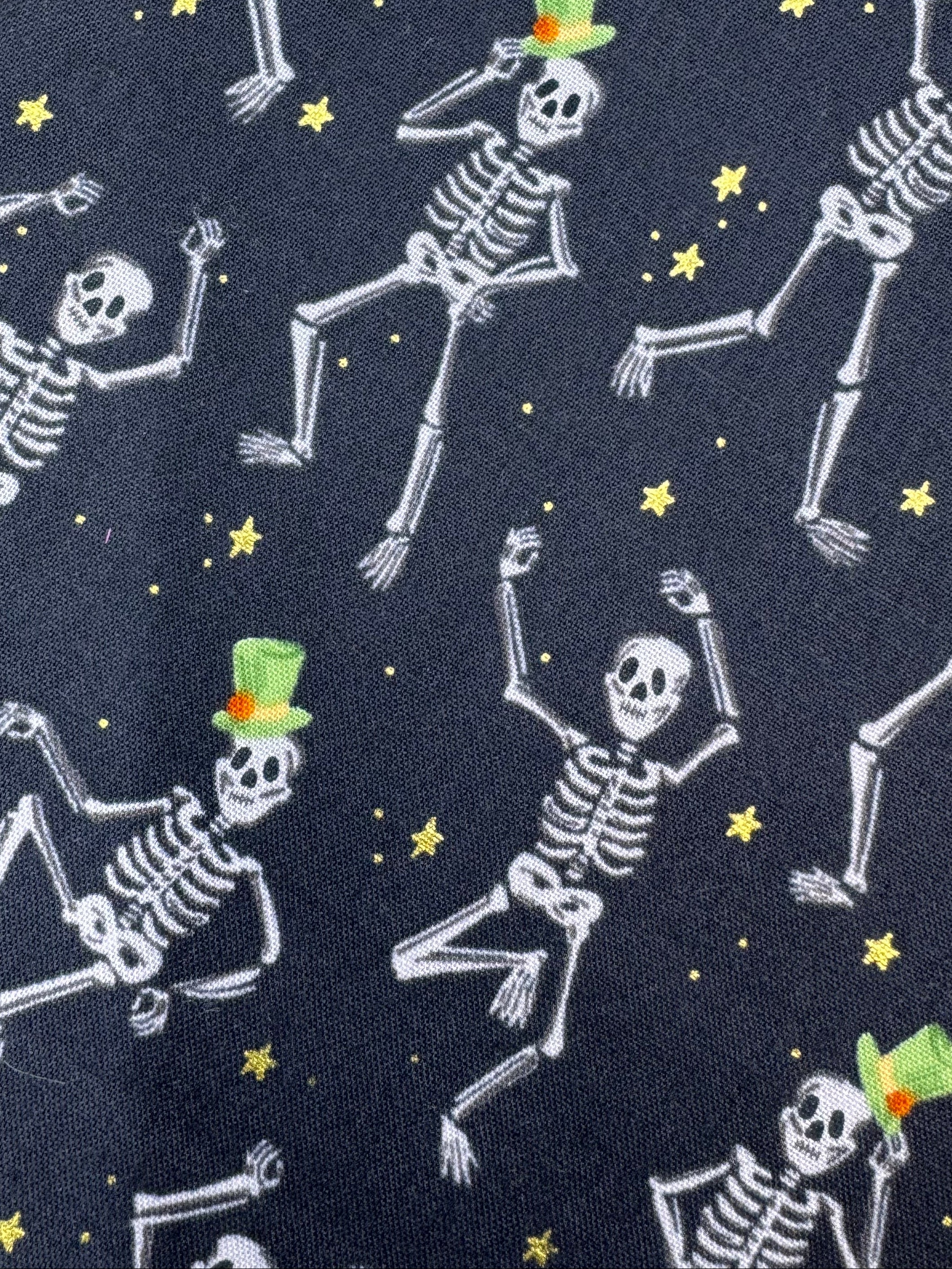 Fabric with skeleton pattern on a wooden surface