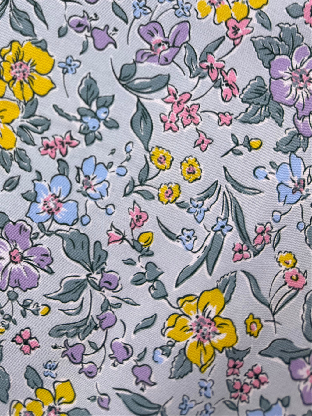 Floral-patterned fabric on a wooden surface
