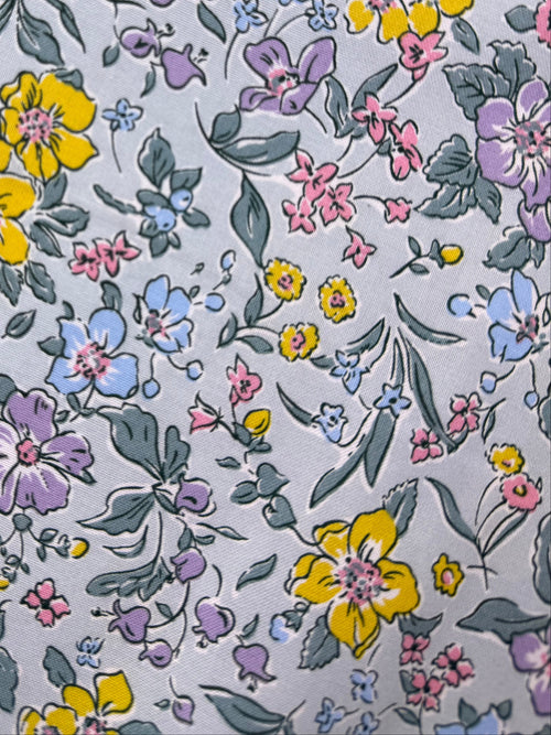Floral-patterned fabric on a wooden surface