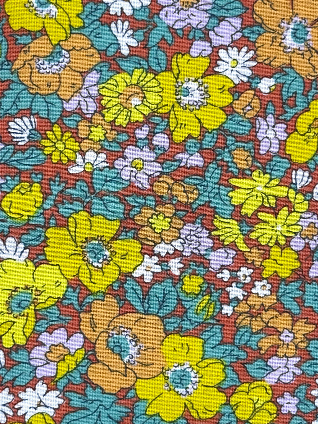 Yellow and teal blooms on red background