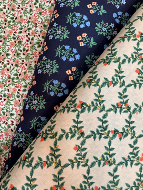 Three different floral patterned fabrics arranged together.
